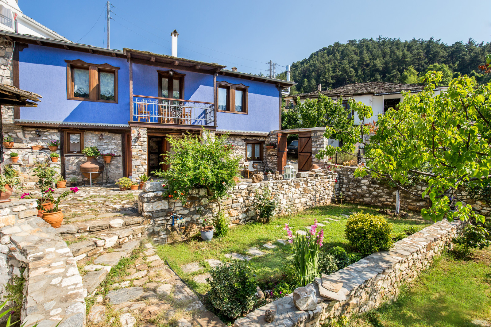 Exterior, courtyard, and village view 1 at Maroyda Stonehouse in Panagia, Thassos